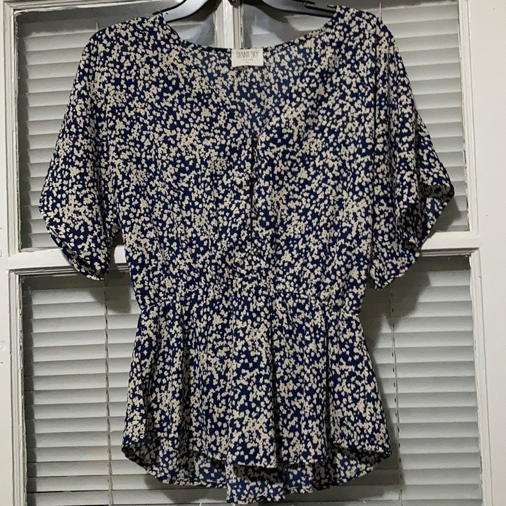 White and blue peplum blouse